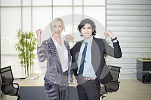 Business people are happy with business success in office