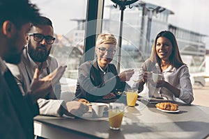 Business people having breakfast