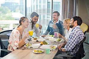 Business people having breakfast