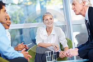 Business people having happy discussion. Portrait of successful business people having discussion at office.