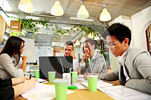 Business people having meeting around table