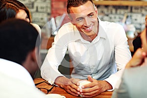 Business people having meeting around table