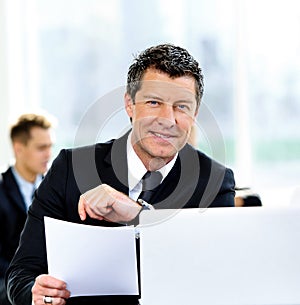 Business people having meeting around table