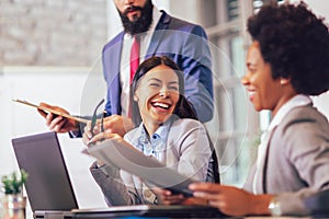 Business people having meeting around table in office