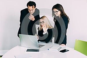 Business people having meeting around table in modern office