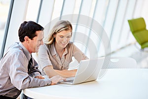 Business people Having Meeting Around Table In Modern Office