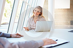 Business people Having Meeting Around Table In Modern Office