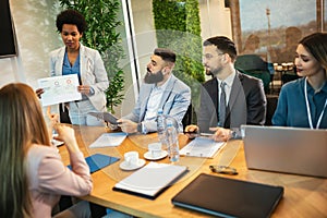 Business people having a meeting or presentation and seminar in the office.