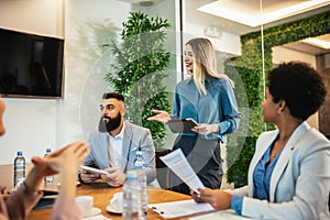 Business people having a meeting or presentation and seminar in the office.