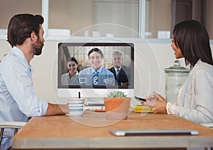 Business people having a video call with colleague on computer