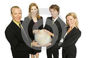 Business people hold a globe