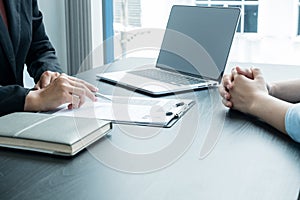 Business people hold a resume and talk to job applicants for job interviews about careers and Her personal history in the company