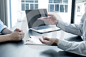 Business people hold a resume and talk to job applicants for job interviews about careers and Her personal history in the company