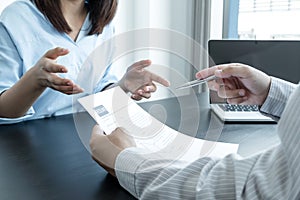 Business people hold a resume and talk to job applicants for job interviews about careers and Her personal history in the company