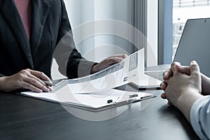 Business people hold a resume and talk to job applicants for job interviews about careers and Her personal history in the company