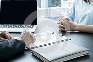 Business people hold a resume and talk to job applicants for job interviews about careers and Her personal history in the company