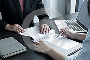 Business people hold a resume and talk to job applicants for job interviews about careers and Her personal history in the company