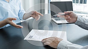 Business people hold a resume and talk to job applicants for job interviews about careers and Her personal history in the company