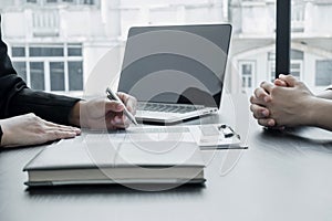 Business people hold a resume and talk to job applicants for job interviews about careers and Her personal history in the company