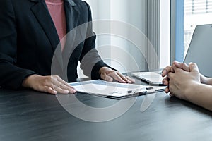 Business people hold a resume and talk to job applicants for job interviews about careers and Her personal history in the company