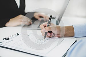 Business people hold a resume and talk to job applicants for job interviews about careers and Their personal history in the