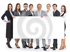 Business people holding a banner