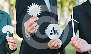 Business people holding eco alternative energy and recycle icon. Gyre