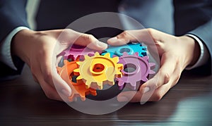 Business People holding Gears and Teamwork Concept, Business team connect pieces of gears. Teamwork, partnership and integration c