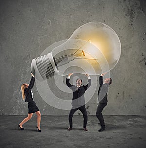 Business people hold a light bulb. concept of new idea and company startup