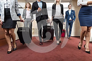 Business People In Hotel Lobby, Mix Race Businesspeople Group Guests Arrive photo