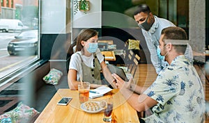 Business people at an informal business meeting in a cafe