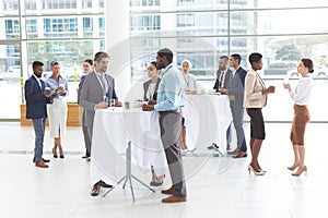 Business people interacting with each other at table during a seminar