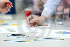 Business People Interaction - office Table with Charts and People Hands