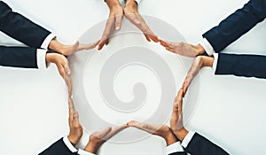 Business people join hand as frame for copyspace. Shrewd