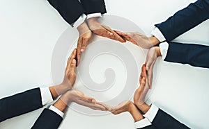 Business people join hand as frame for copyspace. Shrewd