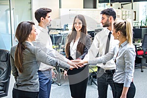 Business people join hand together during their meeting in office.