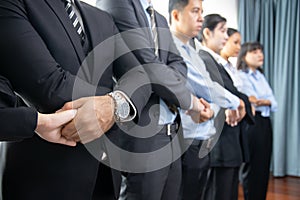 Business people joining hand together and standing in line. Meticulous