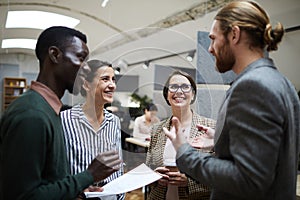 Business People Laughing at Coffee Break