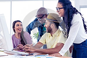 Business people laughing at desk