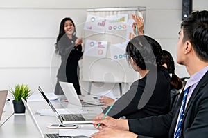 Business people listening to meeting presentation.