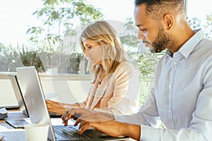 Business people look concentrated while working on their laptops in the office