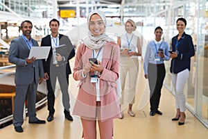 Business people looking at camera in a modern office