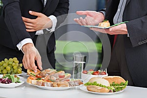 Business people at lunch buffet