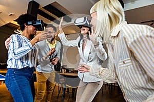 Business people making team training exercise during team building seminar using VR glasses