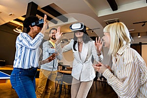 Business people making team training exercise during team building seminar using VR glasses