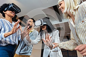 Business people making team training exercise during team building seminar using VR glasses