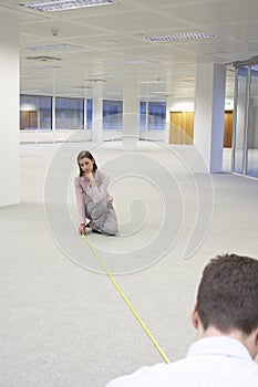 Business People Measuring New Office Space