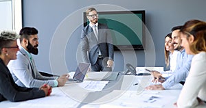 Business people meeting around table