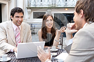 Business people meeting in cafe.