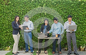 Business People Meeting Corporate Digital Device Connection Concept on tree wall